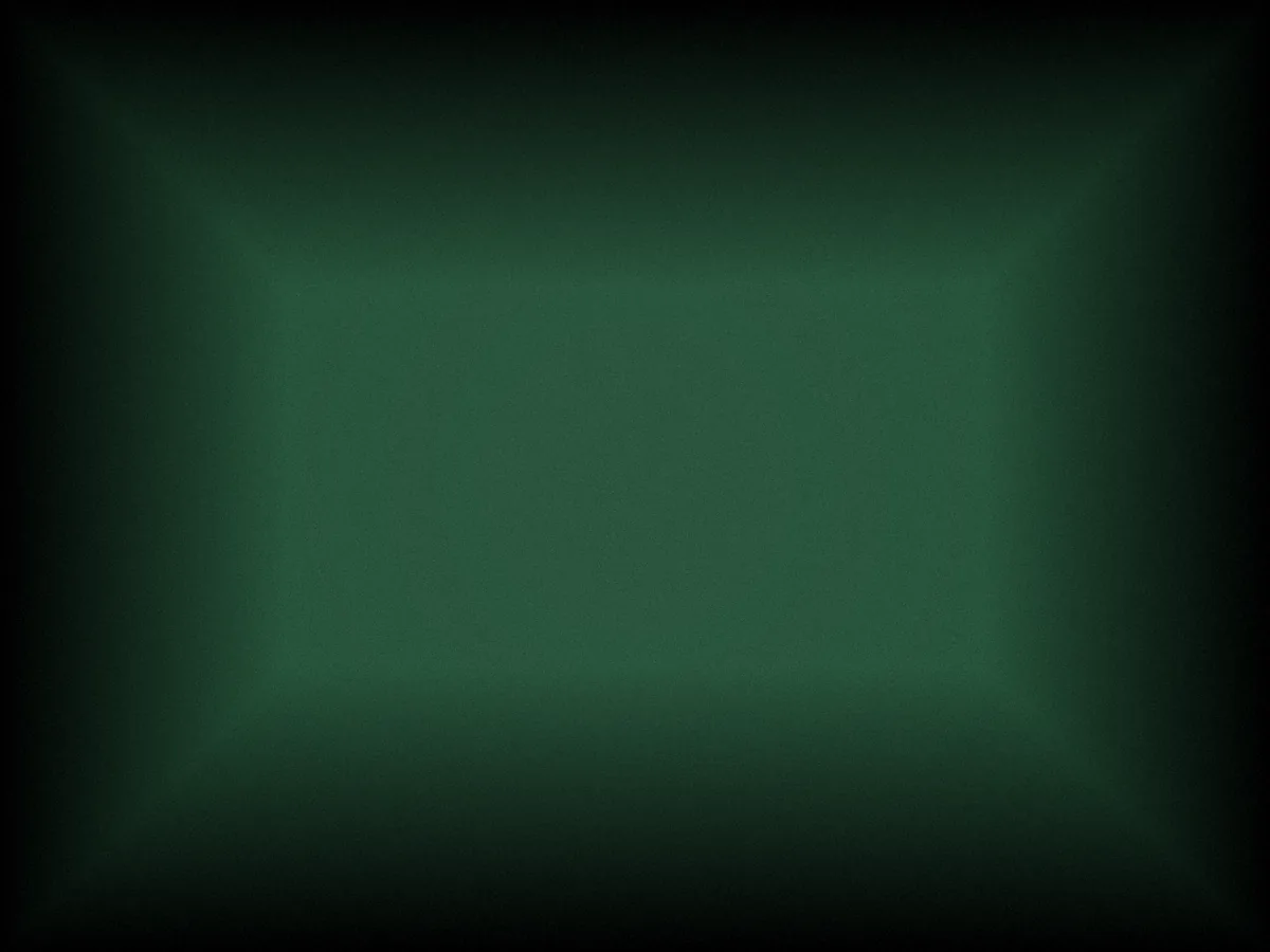 Editorial close-up photograph of a wooden tray filled with rummy tiles arranged in loose sets on dark green felt